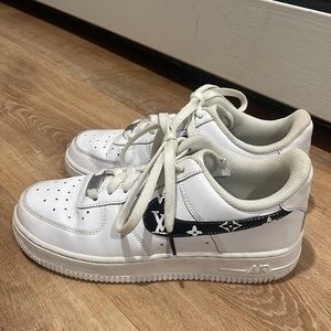 Nike Air Force Ones customized with Louis Vuitton print.